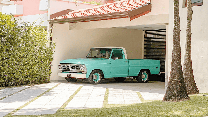 A car is parked in the shade.