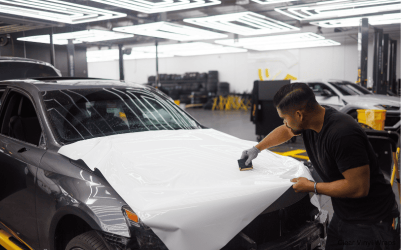 A car wrapped with clear vinyl, providing invisible protection while maintaining the original paint's shine and color.