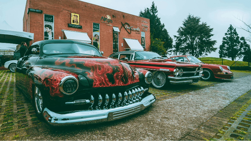 Three luxury cars with customized vinyl car wraps