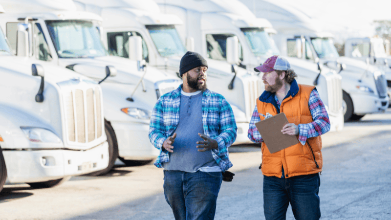 A man is consulting with the truck seller.