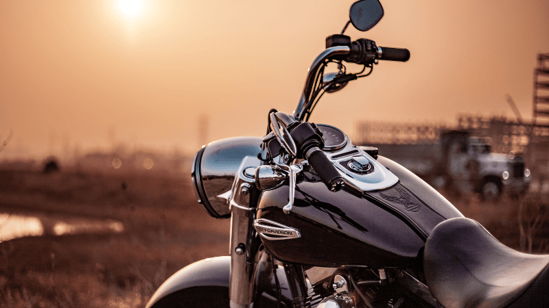 The wrap on the motorbike is resisting the sunlight.