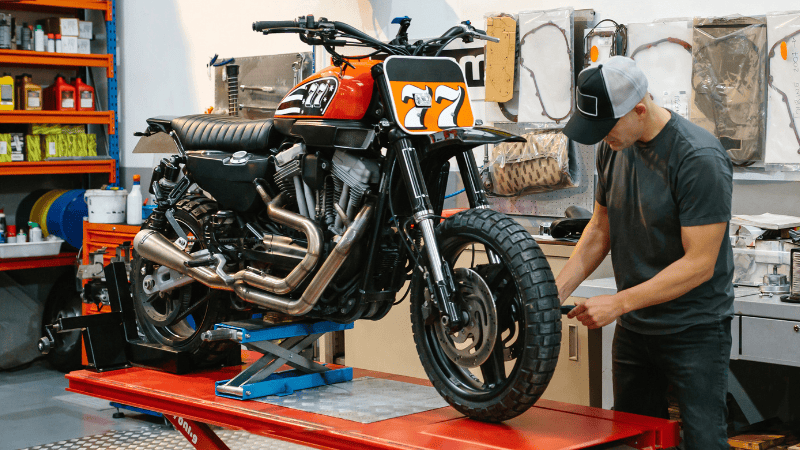 An expert of Carlike is designing the motorbike's wraps.