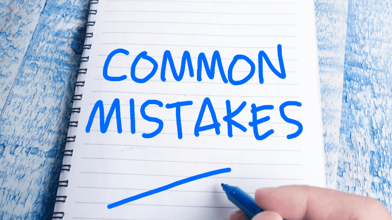 A notebook with "COMMON MISTAKES" written on it.