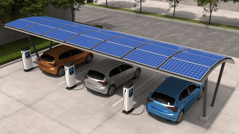 Three cars are parked in the shade.