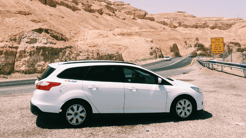 A white car on the Gobi road.