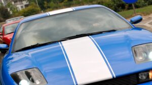 A blue vehicle with hood creative film.