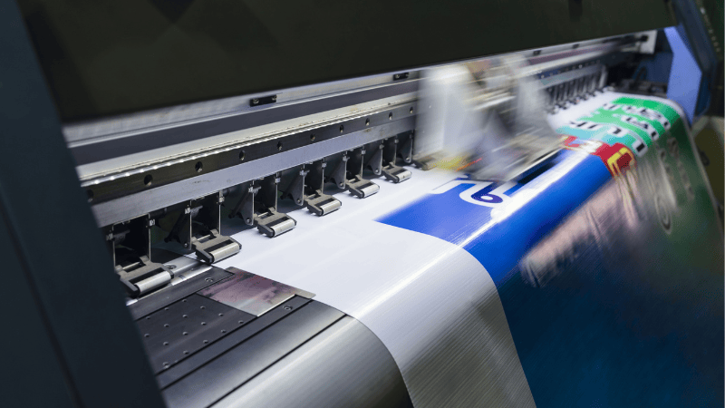 A machine is printing vinyl decals.
