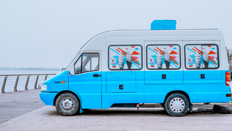 A commercial van wrapped with car wraps