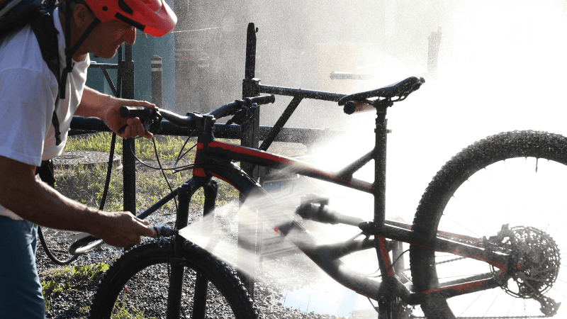 Bicycle being cleaned with a microfiber cloth