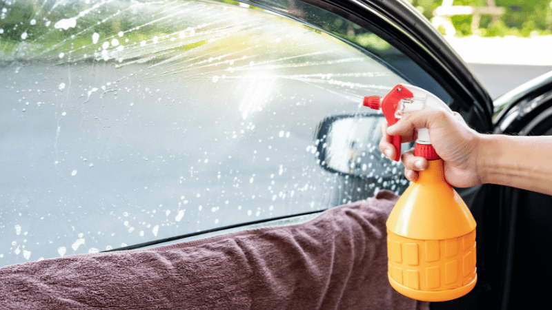 clean the car tinted window.